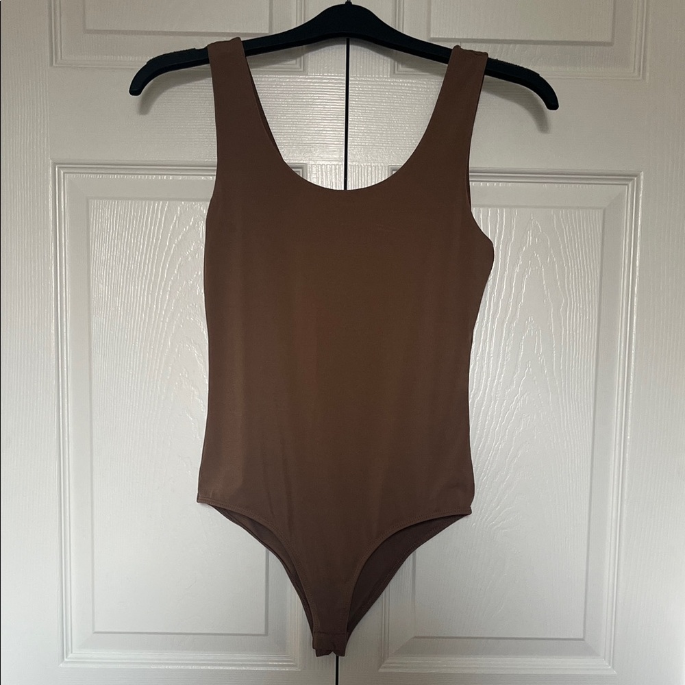 Ambiance Tan/light brown bodysuit with snap closure